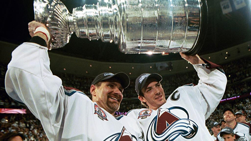 DENVER, COLORADO - JUNE 9: Ray Bourque #77 of the Colorado Avalanche lifts the cup with Joe Sakic #19 after the Colorado Avalanche defeated the New Jersey Devils 3-1 in game seven of the NHL Stanley Cup Finals at Pepsi Center in Denver, Colorado. The Avalanche take the series 4-3. (Photo by B Bennett/Getty Images)